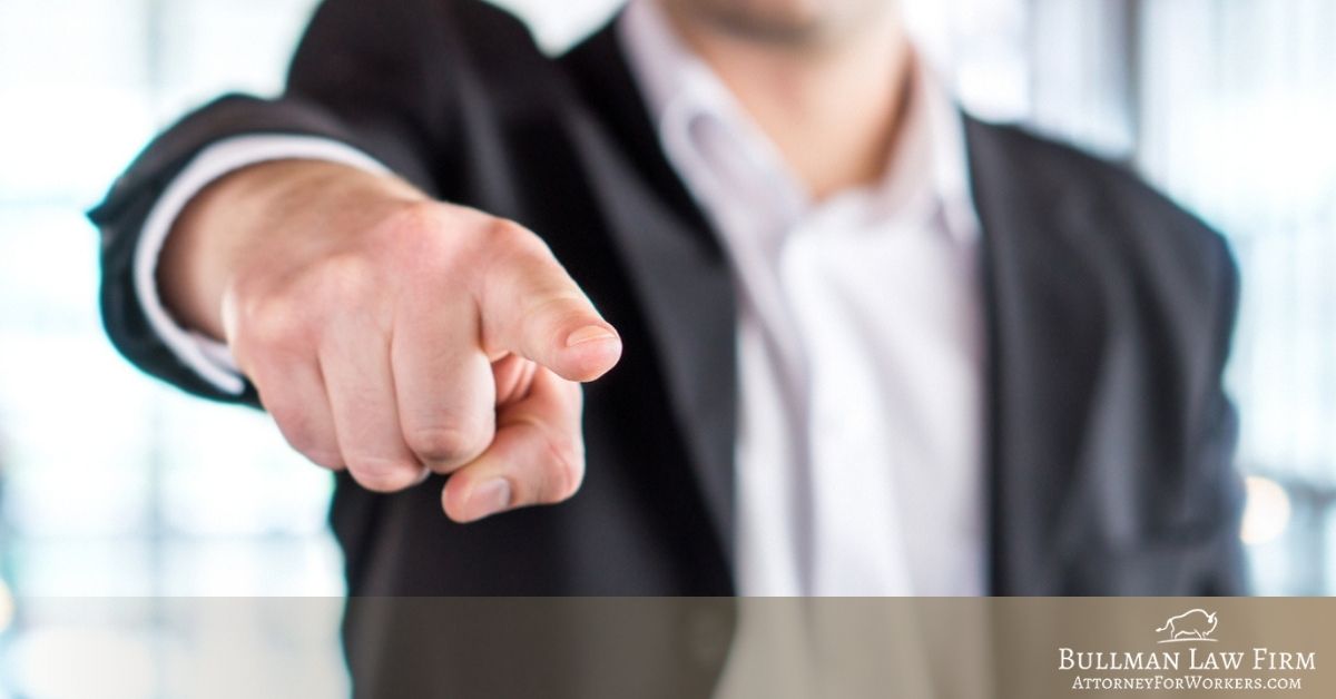 Man pointing a finger at the camera